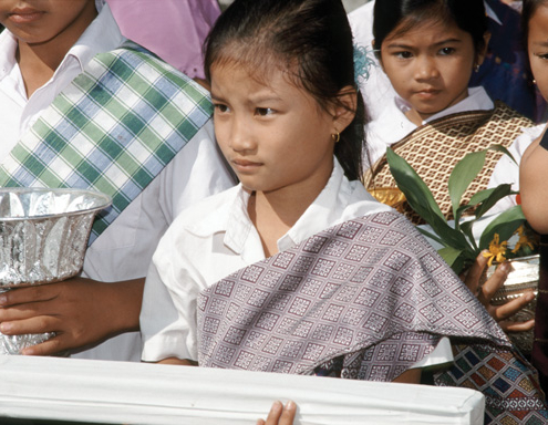 Young girl carrying manuscript, Savannakhet